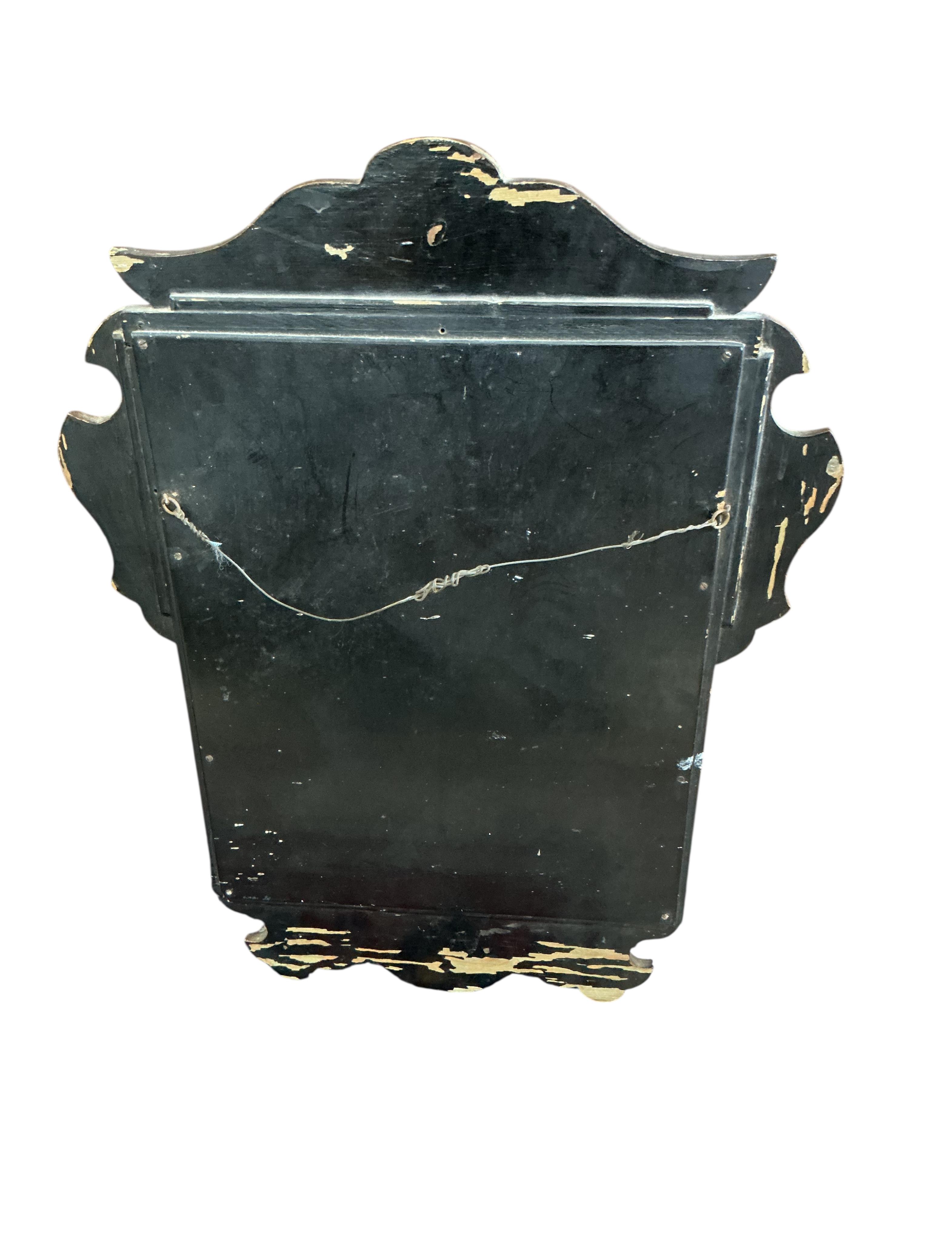 A chinoiserie lacquer fret cut wall mirror, width 53cm, height 72cm